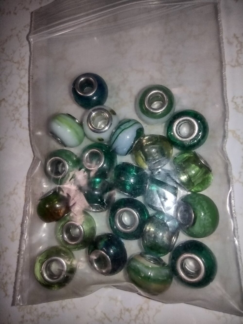 Approximately 22 lovely new complementary glass beads